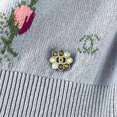 Sky blue Chanel sweater with rose motifs