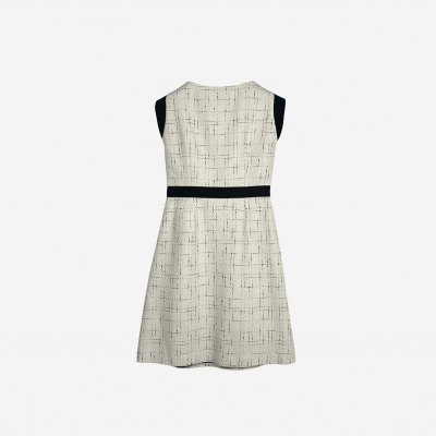 Short Edward Achour ecru tweed dress with black ribbon.