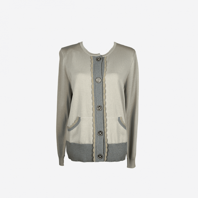 Edward Achour beige cardigan with scalloped edges.