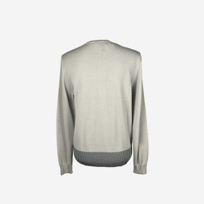 Edward Achour beige cardigan with scalloped edges.