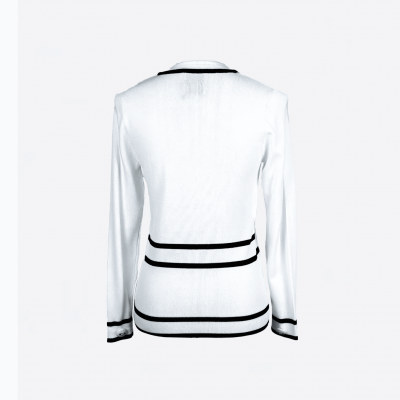 Edward Achour black and white cardigan with gold buttons.