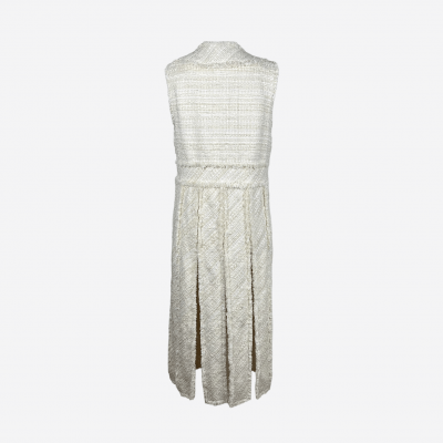 Edward Achour long ecru tweed coat with lace and fringe.