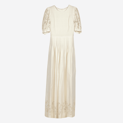 Valentino long ecru dress with openwork lace and balloon sleeves.