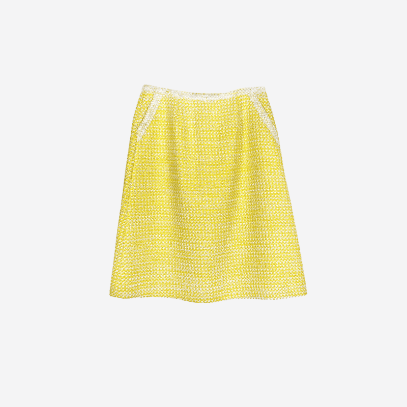 Edward Achour yellow tweed midi skirt with off-white trim.