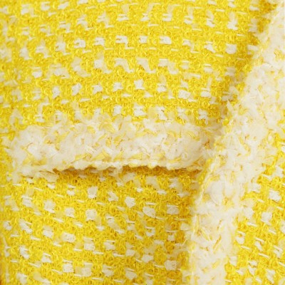 Edward Achour mid-length yellow tweed coat with notched lapel collar.