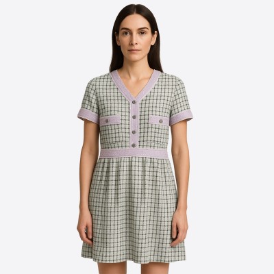 Short Edward Achour dress in green and lilac tweed, finished with elegant buttons.